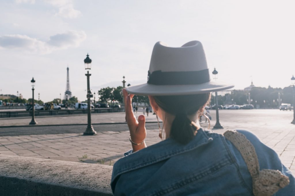 French lady looking at the Eiffel Tower