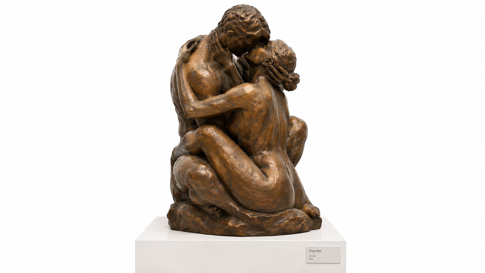 A bronze sculpture depicting a man and a woman embracing and kissing, titled Together.
